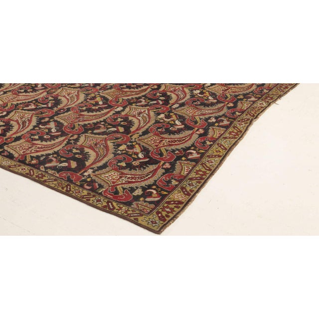 This striking antique Karabagh rug, handwoven in the Caucasus during the 1920s, presents a vivid and highly stylized...