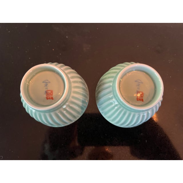 Japanese 1970s Japanese Celadon Vertical Pattern Trumpeted Teacups With Blue White Village Designs - Pair For Sale - Image 3 of 4