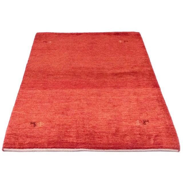 Gabbeh rug | Size: 143 x 100 cm | Knot density: 50,000 – 150,000 knots/m² | Material: Hand-spun sheep and goat wool |...