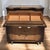 A sculptural 1950s tallboy or gentleman’s chest with a raised drop-front cabinet, three spacious lower drawers,...