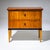 Two-drawer Biedermeier chest of drawers veneered in cherrywood, with ebonized details and a rootwood-veneered top. The...