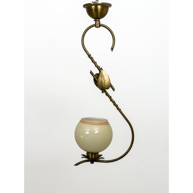 Two rare Swedish Modern pendant lamps, crafted with the quiet elegance that defined Scandinavian design during the mid-...