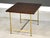 A mid century modern brass and mahogany rectangular end table designed by Paul McCobb for Calvin. Professionally...
