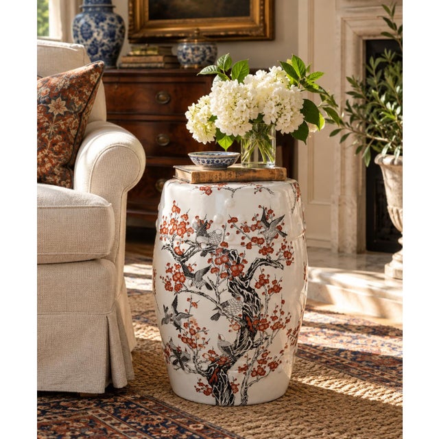A classic Chinoiserie orange and black porcelain garden stool, plant stand, or small side table featuring Asian motifs,...