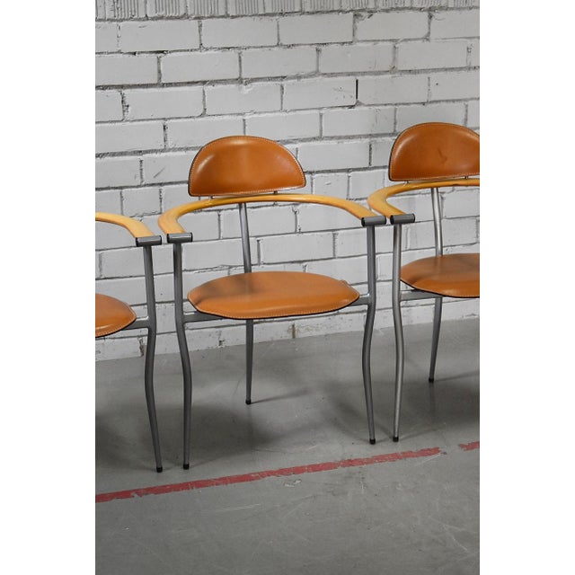 Comes in original vintage condition. Painted metal frame and leather upholstery. Beech armrests. This piece has an...