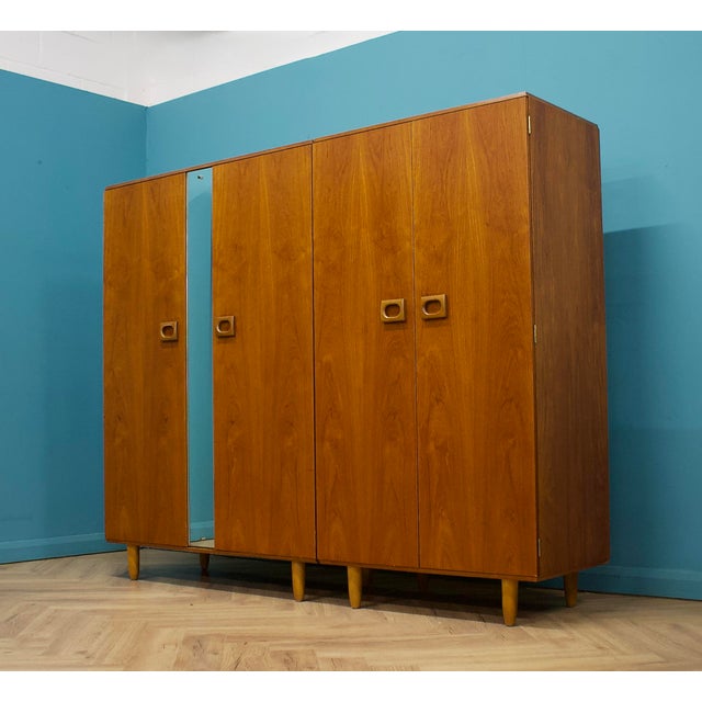 A well-proportioned mid-century wardrobe by Stonehill, crafted in warm, richly grained teak with clean modernist lines....