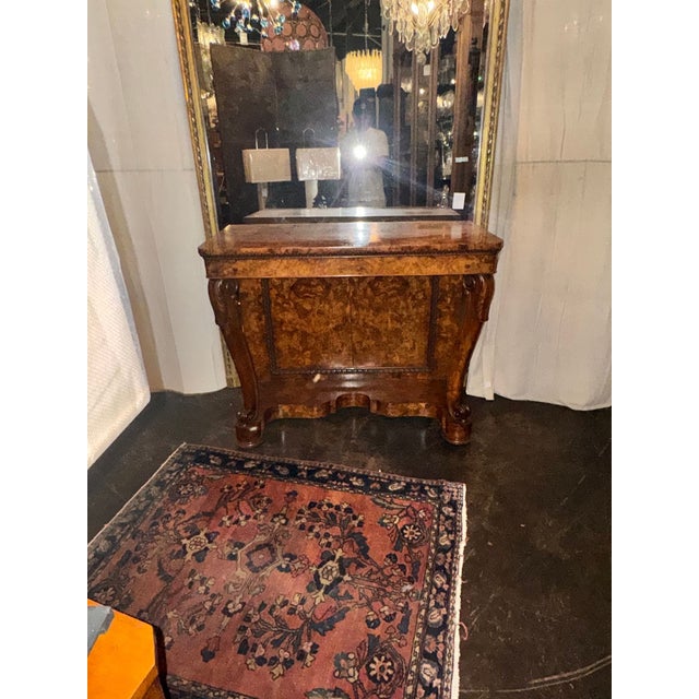 The 19th c. Italian Burl Walnut Console is a luxurious piece of furniture perfect for adding sophistication to any home ....