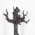 An impressive late 19 century Black Forest carved bear hall stand, of a bear looking up while holding a tree with three...