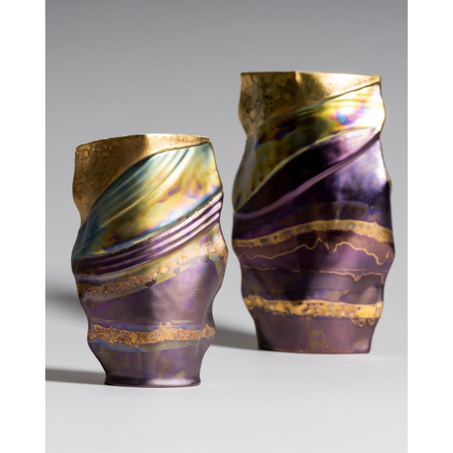 Two fine-porcelain vases combining the folded, softly undulating forms of dutch ceramicist johan van loon with helmut...