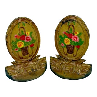 1920’s Cast Iron Bookends Handpainted Enamel Finish Oval Shape Basket Filled With Flowers Motif - A Pair For Sale