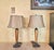 A pair of Mid-Century Modern teak and metal double pull-chain table lamps by Concord Lamp & Shade, renowned for their...