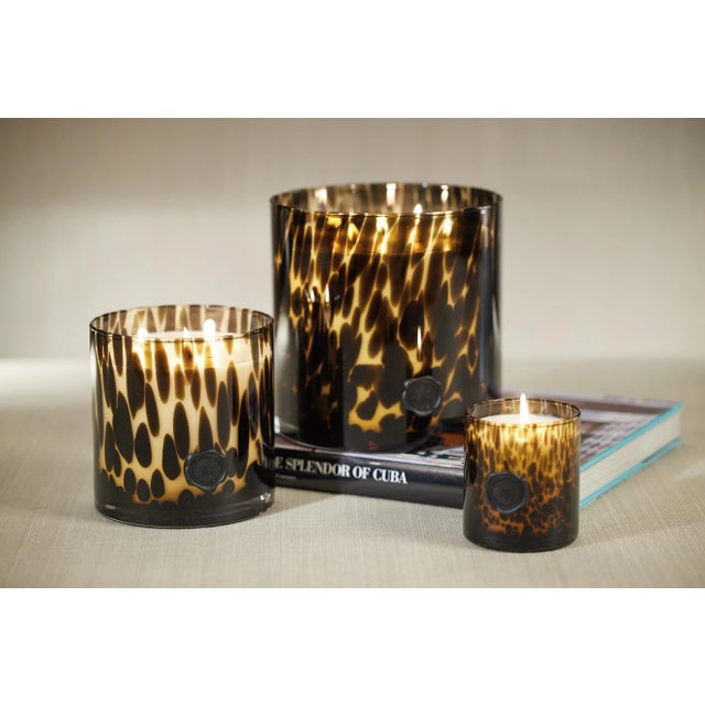 Infuse a luxury fine fragrance and light into your home with this lovely candle. Its elegant glass jar design with seal...
