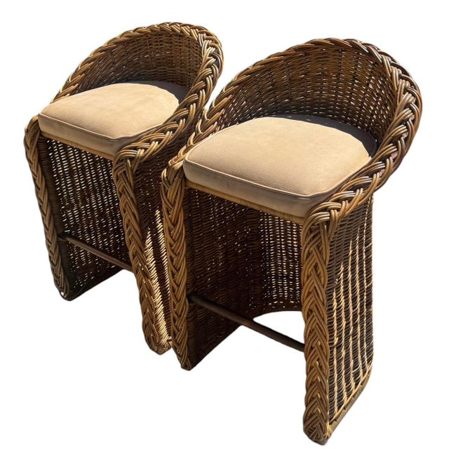 Braided rattan counter height stools. Brass foot rail. Leather seats. Great for a kitchen or bar. Dimensions 22"W x 23.5"D...