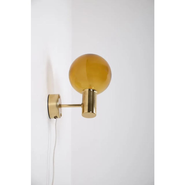 Pair of brass wall lights 'Patricia' with smoked glass, designed and produced by Hans-Agne Jakobsson, Markaryd, Sweden,...
