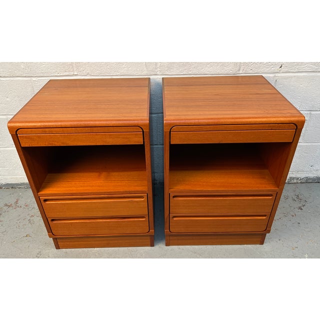 Exceptional pair of vintage Danish Modern teak nightstands designed by renowned Danish designer Nils Jonsson for Tørring...