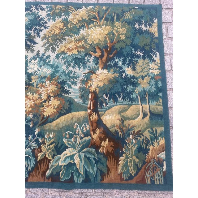 Discover the timeless elegance of this late 20th-century Aubusson tapestry featuring a captivating design of a forest....