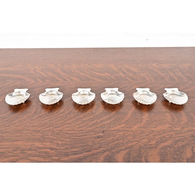 A gorgeous set of six sterling silver shell-shaped salt cellars or nut bowls By Tiffany & Co. (signed to the underside)...