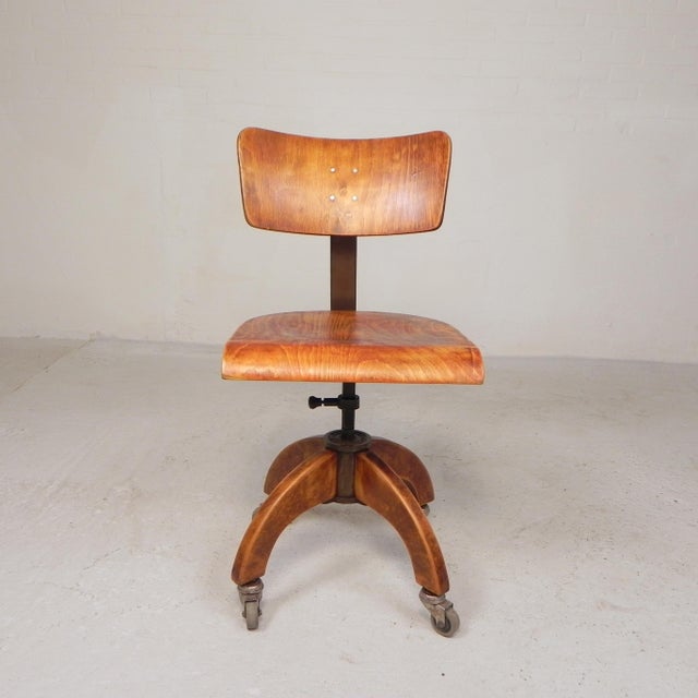 The chair is not height-adjustable, but it swivels and has a spring mechanism. Perfect for your workspace, studio, office,...