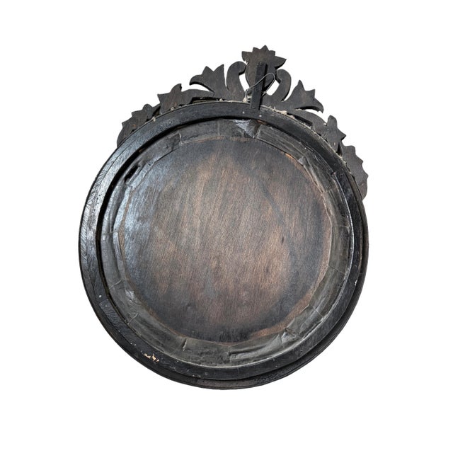 A beautiful antique Venetian mirror featuring classic etched‑glass panels, a heart‑shaped crest, and delicate dotted...