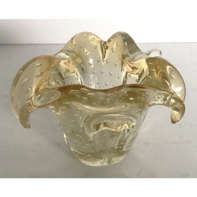 Vintage Italian light amber Murano glass bowl carefully hand blown with small bubbles inside the glass using pulegoso...