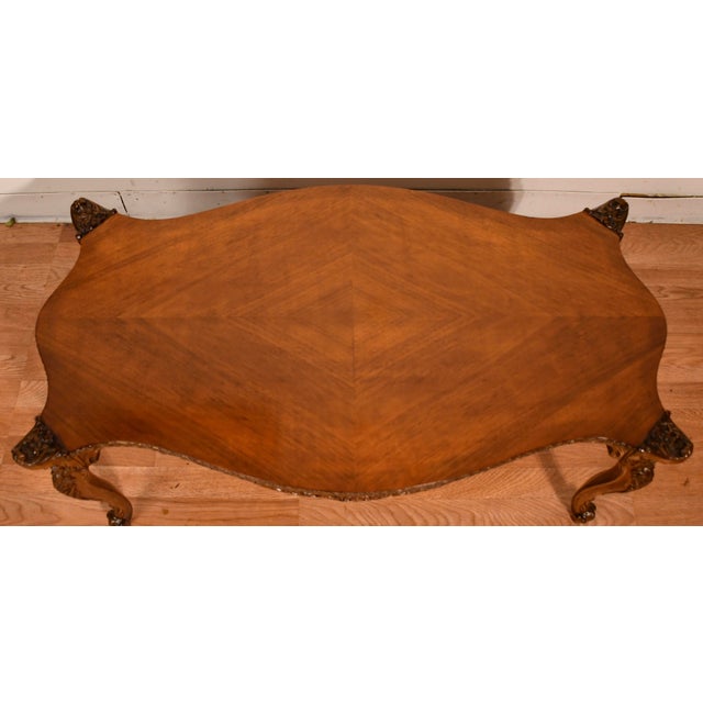 We are pleased to offer this beautiful French coffee table, from the 1930s. This table is made of Walnut wood supported...