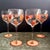 A beautifully set of four vintage Gibson balloon wine glasses featuring hand-painted style autumn leaves in warm orange...