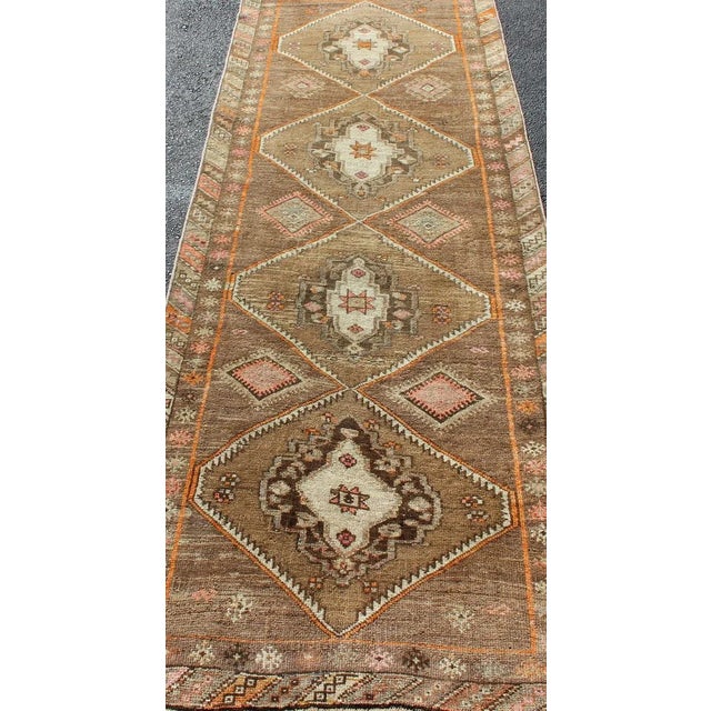 Textile Vintage Hand Knotted Turkish Oushak Runner With Tribal Medallions in Earthy Tones For Sale - Image 7 of 11