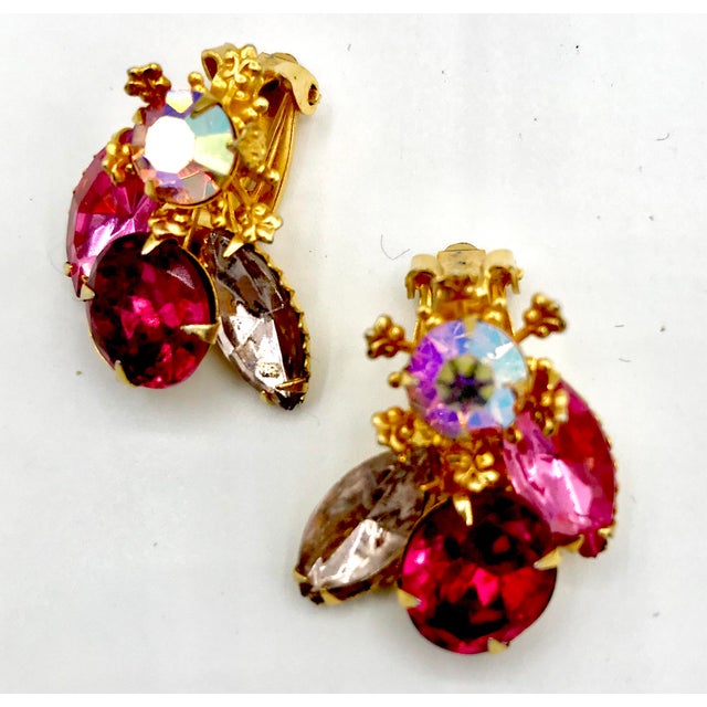 This is part of Chairish’s Costume Jewelry assortment. Aren’t these pretty in pink? Lovely 1940s clip-on earrings signed...
