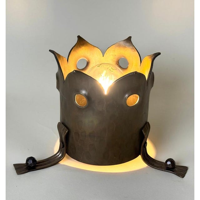 A striking hand-crafted brass flush-mount ceiling light dating from the 1960s. The sculptural construction, substantial...