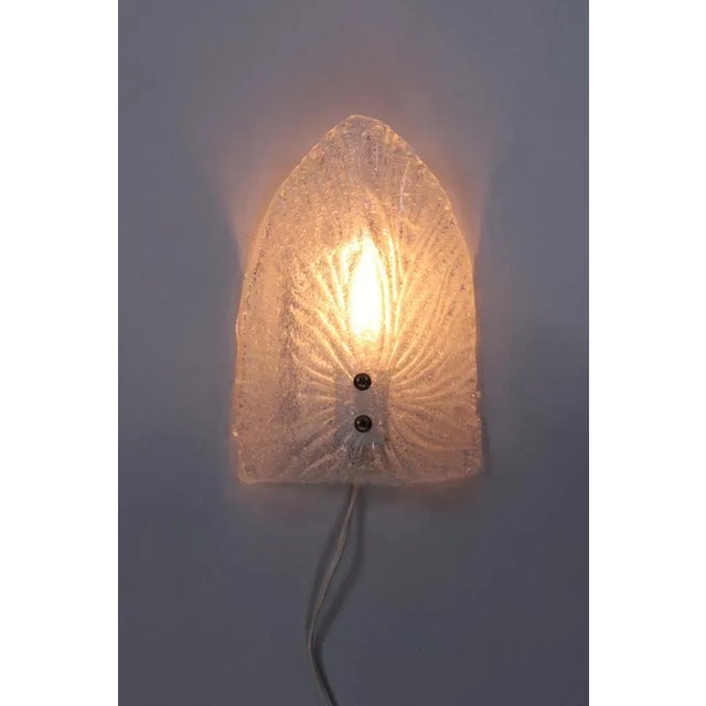 Stylish wall lamp with a thick pressed glass shade in abstract pattern made by Globen AB - Swedish design made in the...
