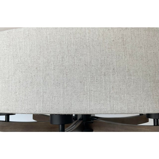 This contemporary juxtaposition of materials boasts a warm walnut finished wood frame, black metal cage candle sleeves and...