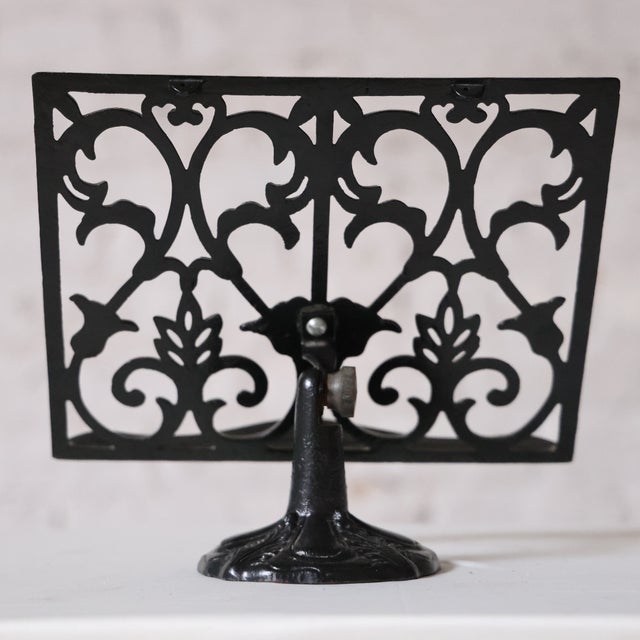 Dating to the 19th century, this French tabletop music stand is crafted from black iron with a timeless, utilitarian...