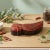 Dimensions: 8" W x 3" D x 2" H This is a vintage spice box with compartments, shaped and carved in the shape of a parrot.