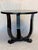This Art Deco walnut Black Lacquer side table from 1930s France was crafted with a round structure, it features three...