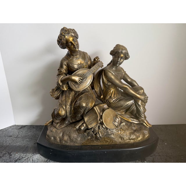 A beautifully detailed late-19th-century French gilt-bronze figural group attributed to Adrien Étienne Gaudez (French,...