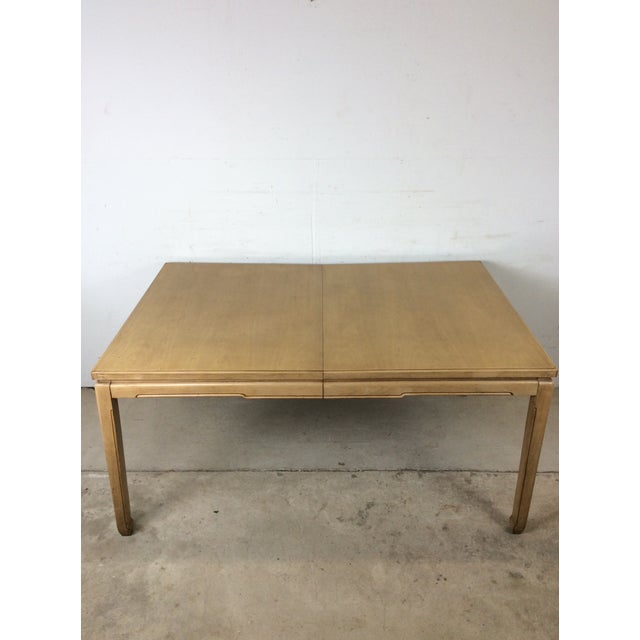 This mid century modern dining table features hardwood construction, original blonde finish, expandable top with 3...