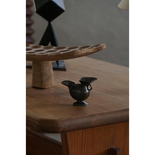 A finely crafted art deco scandinavian decorative vase by just andersen, model d‑118, produced in denmark around the 1930s...