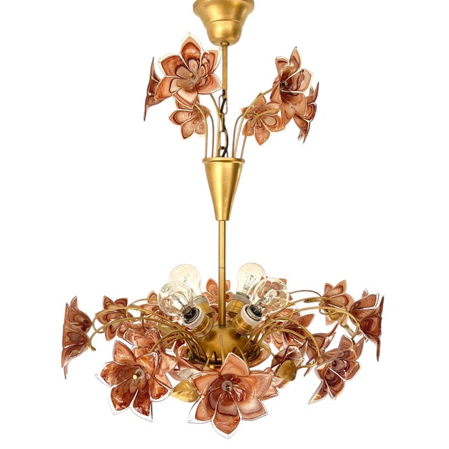 This large and highly decorative Murano flower bouquet chandelier features elegant brown and amber-toned hand-blown glass...