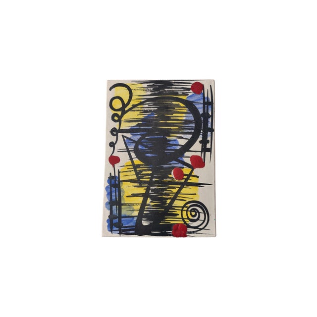 The artwork features an abstract composition painted on a rectangular glazed ceramic tile. The piece is characterized by a...