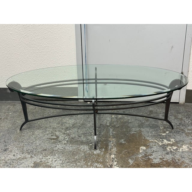 Design Plus Gallery presents a Vintage French Art Deco Style Wrought Iron Oval Glass Coffee Table. This distinctive table...