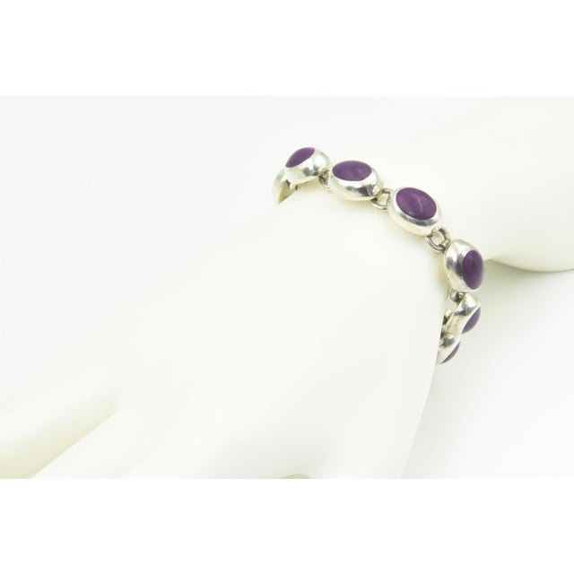 Mexican Sugilite Oval Link Sterling Silver Bracelet Striking Mexican sterling silver bracelet featuring nine oval links,...