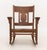 Arts and Crafts Oak Rocking Chair, with geometric backsplat. 34.25" H x 27.5" W x 35.5" D; seat: 15" H. Provenance: From a...