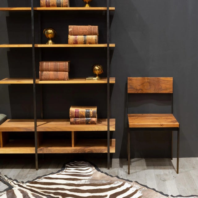 ABOUT A set of four "Ohio WC1" Black Walnut dining chairs with blackened steel frames. Sculpted back rests. CREATOR Ohio...