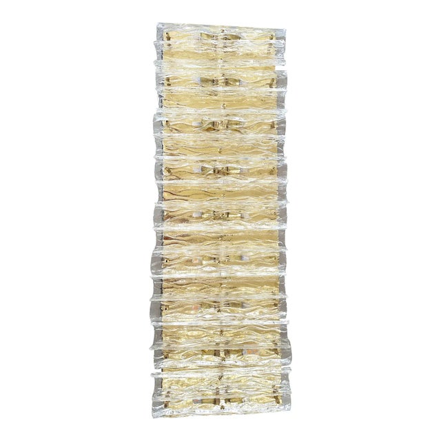 Huge rectangular wall sconce in unlaquered brass and Transparent Murano glass with a partcular shape that give brigtness ....