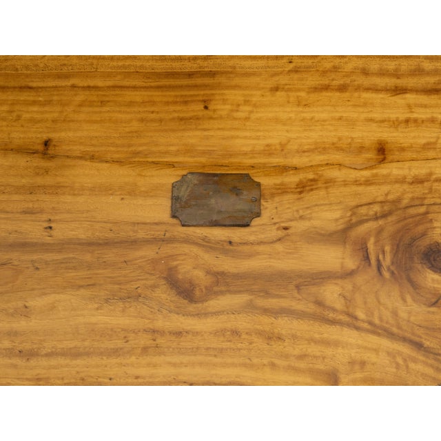 An English camphor wood trunk from the late 19th century with brass accents. Created in the last decade of the 19th...