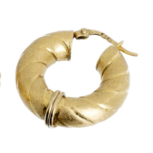 Pair of 19.2K gold hoop earrings. Portuguese; 20th century; in 19.2 kt gold; hollow satin-finished body. with 'deer'...