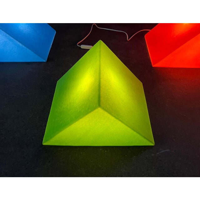 Postmodern prism-shaped floor/table lamp by Heico. Shown here in green. These lamps feature the graphic form of a prism....