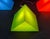 Postmodern prism-shaped floor/table lamp by Heico. Shown here in green. These lamps feature the graphic form of a prism....