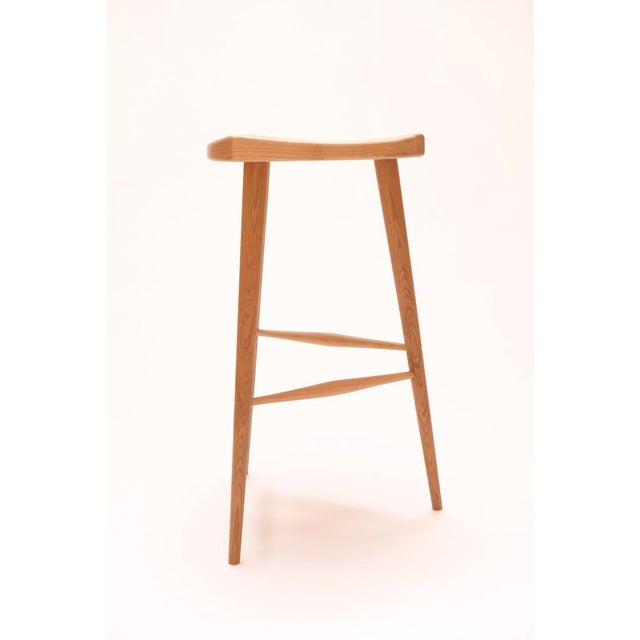Inspired by the Nakashima "Mira Stool" our solid wood seat has three gentle slopes showcasing split tenon wedge joinery...