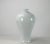 This contemporary vase with glossy white finish and smooth high shoulders pose a simple streamline form. Each one is hand...